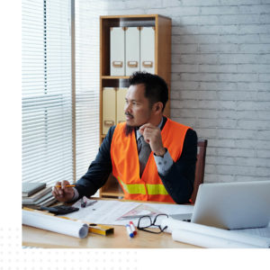 Man with Industrial and Engineering documents 