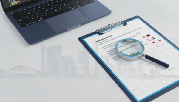 Structured checklist with multilingual text, magnifying glass, laptop; modern review workspace.